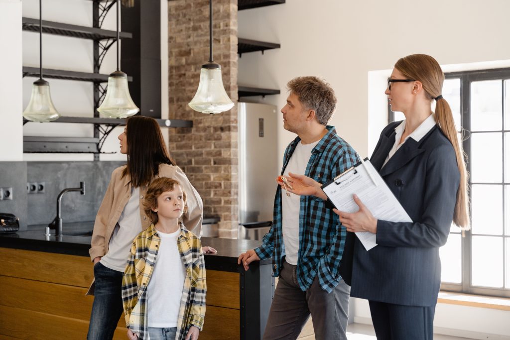 Real estate professional showing a Seattle rental home to prospective tenants